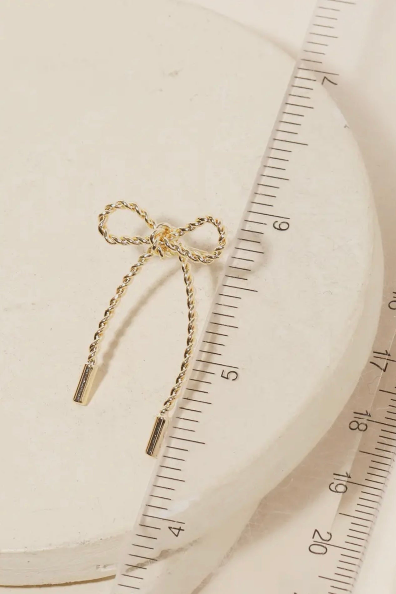TWISTED GOLD BOW TIE EARRINGS